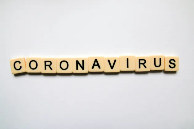 Scrabble letters spell Covid Virus. Photo: Glen Carrie on Unsplash