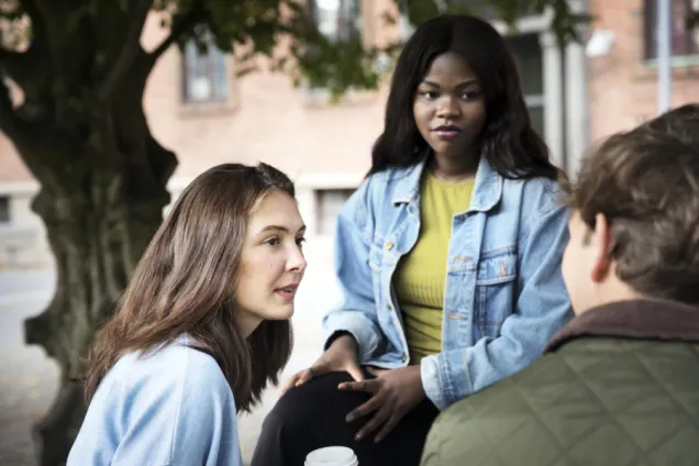 Three students talking. Photo: Johan Bävman