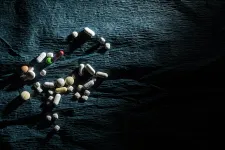Pills on a dark fabric